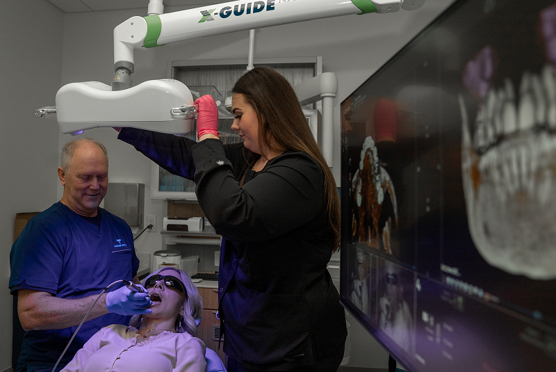 Dr. Bell examining a patient during a procedure
