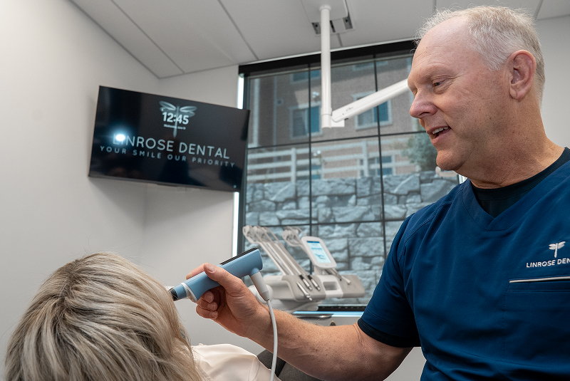 Dr. Bell reviewing patient imaging during consultation