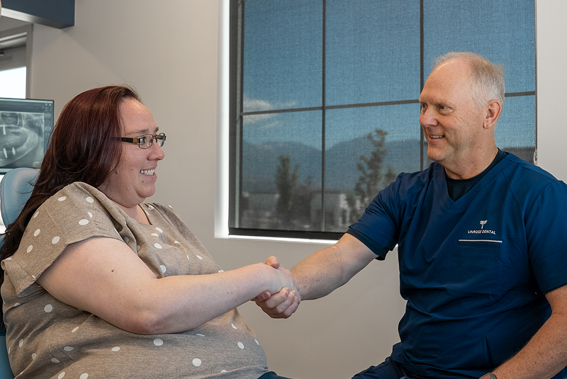 patient and Dr. Bell shaking hands