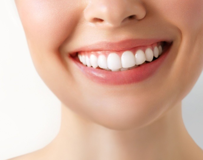 Woman smiling looking straight forward